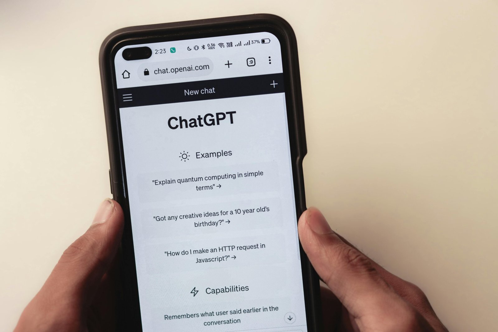 pexels-photo-16629368-16629368 Close-up of hands holding a smartphone displaying the ChatGPT application interface on the screen.